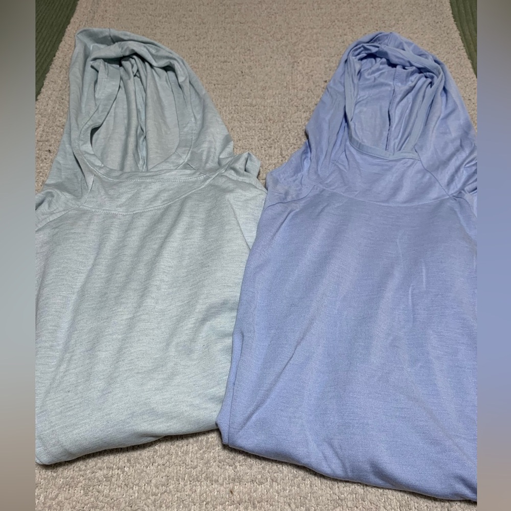 2 women’s Free Fly long sleeve, hooded shirts